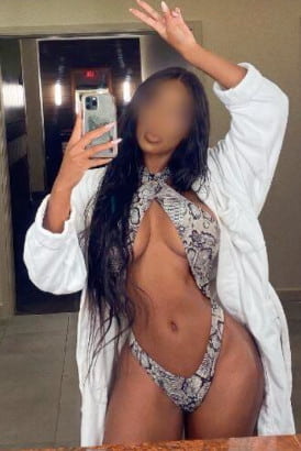Busty black girl with her shirt open taking a selfie =