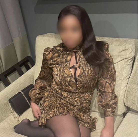 Elegant busty ebony in a sexy dress