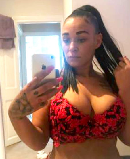 Busty black girl in red lingerie taking a selfie