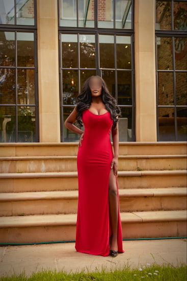 Stunning busty black girl in a full length red dress